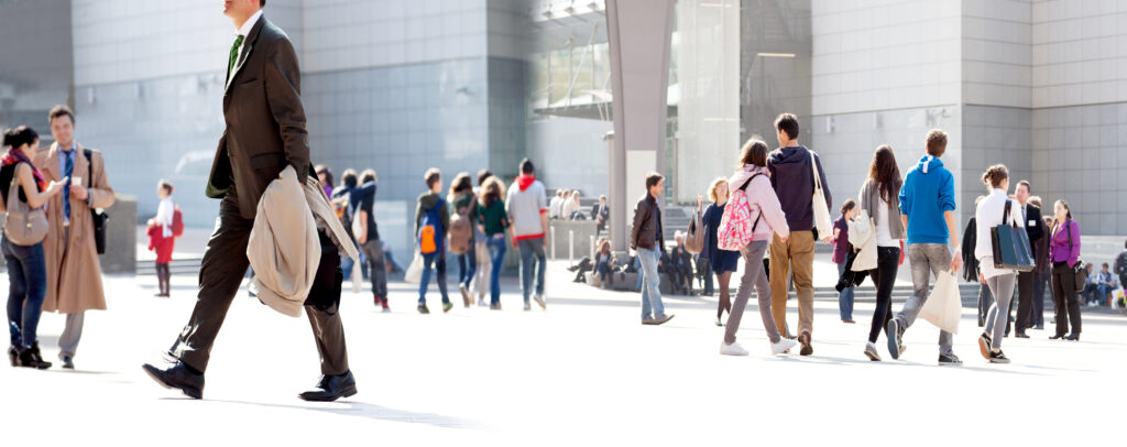 people walking against a light background.